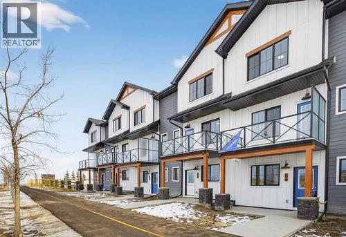Front of home - 64 Creekside Drive Sw, Calgary, AB - Outdoor With Facade