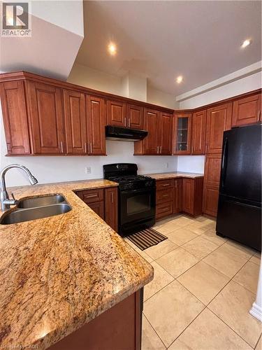 130 Wellington Street N Unit# 201, Hamilton, ON - Indoor Photo Showing Kitchen With Double Sink