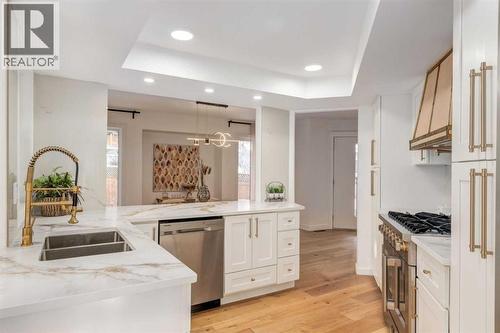 113 Straddock Terrace Sw, Calgary, AB - Indoor Photo Showing Kitchen With Double Sink With Upgraded Kitchen