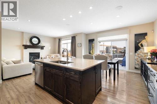 8 Emberside Glen, Cochrane, AB - Indoor With Fireplace