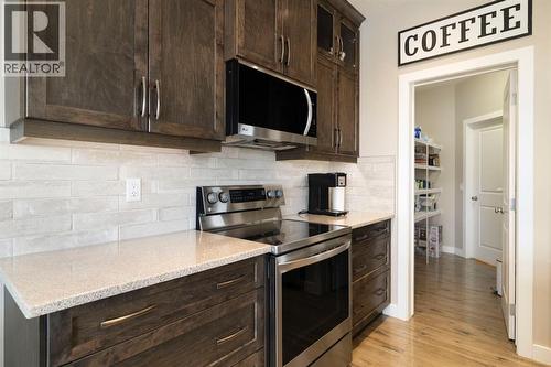 8 Emberside Glen, Cochrane, AB - Indoor Photo Showing Kitchen