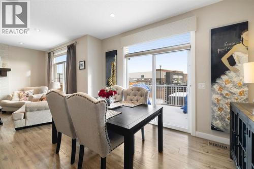 8 Emberside Glen, Cochrane, AB - Indoor With Fireplace