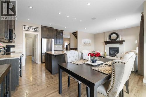 8 Emberside Glen, Cochrane, AB - Indoor With Fireplace