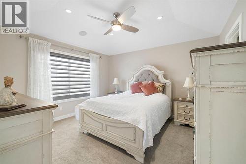 8 Emberside Glen, Cochrane, AB - Indoor Photo Showing Bedroom