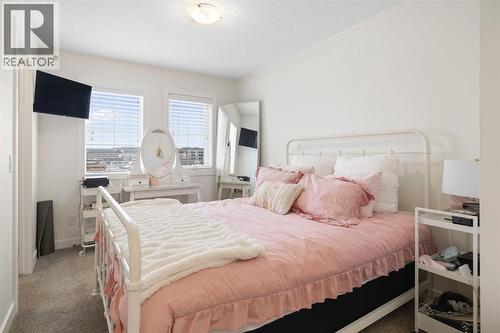 8 Emberside Glen, Cochrane, AB - Indoor Photo Showing Bedroom