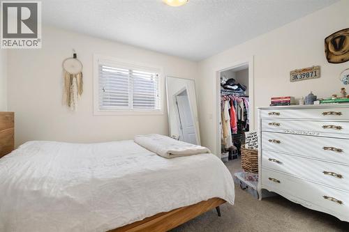 8 Emberside Glen, Cochrane, AB - Indoor Photo Showing Bedroom