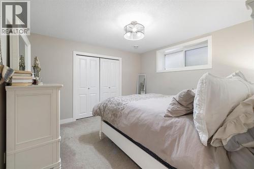 8 Emberside Glen, Cochrane, AB - Indoor Photo Showing Bedroom