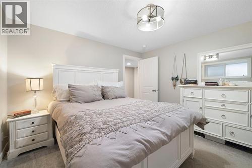 8 Emberside Glen, Cochrane, AB - Indoor Photo Showing Bedroom