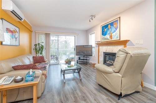 305B-3000 Oak St, Chemainus, BC - Indoor Photo Showing Living Room With Fireplace