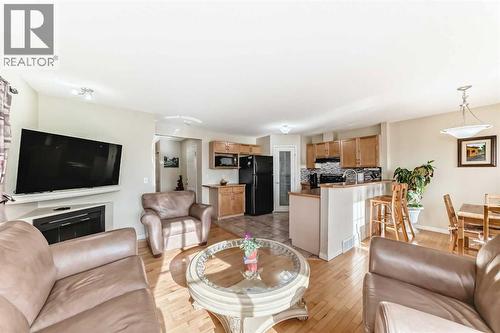116 Hidden Creek Rise Nw, Calgary, AB - Indoor Photo Showing Living Room With Fireplace