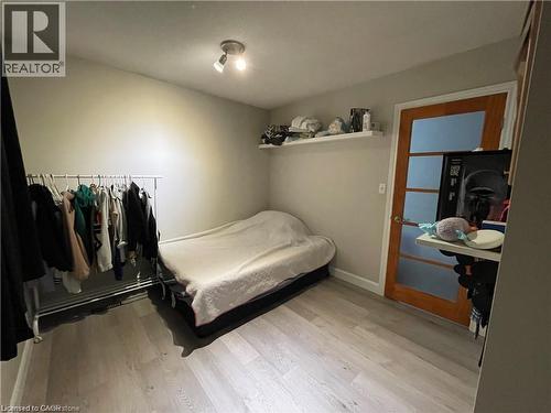 Bedroom featuring light wood-style floors and baseboards - 18 Rosewell Street, Hamilton, ON - Indoor Photo Showing Bedroom