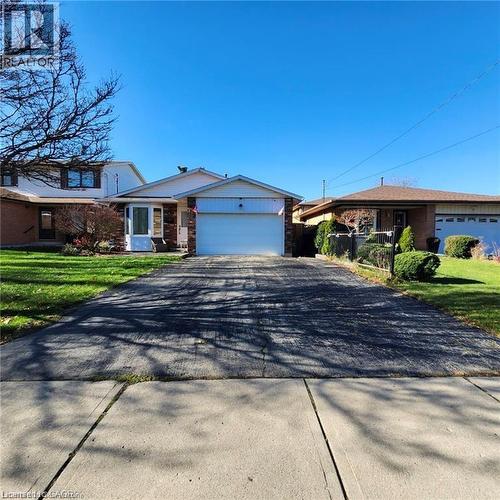 Backsplit home with driveway, a garage, and a front lawn - 18 Rosewell Street, Hamilton, ON - Outdoor