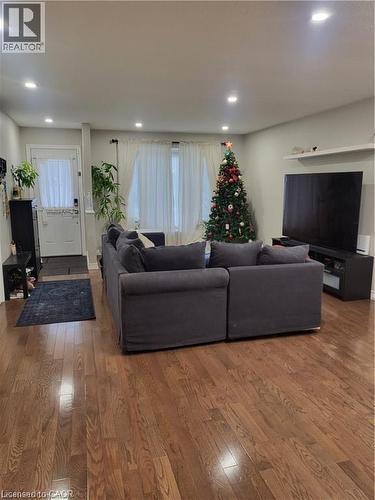 Living room with wood finished floors and recessed lighting - 18 Rosewell Street, Hamilton, ON - Indoor
