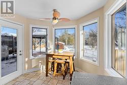 Breakfast nook with access to rear deck. - 