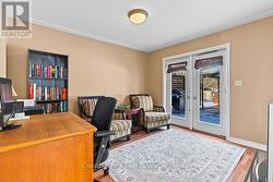 Main floor office/den with access to rear deck. - 