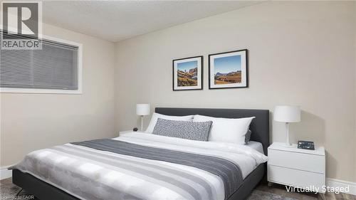 Bedroom with a textured ceiling and wood finished floors - 55 Silver Aspen Crescent, Kitchener, ON - Indoor Photo Showing Bedroom