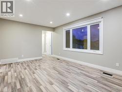 Unfurnished room with light wood finished floors and recessed lighting - 