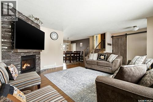 2778 Schweitzer Drive, Regina, SK - Indoor Photo Showing Living Room With Fireplace