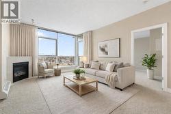 The open-concept living area is anchored by a cozy gas fireplace - 