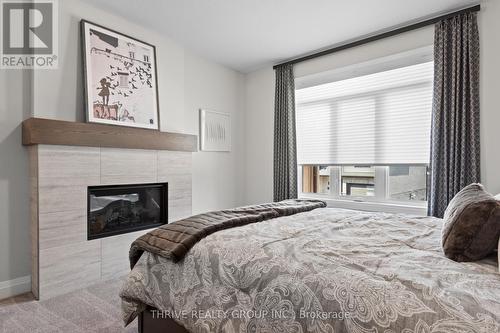 148 - 2261 Linkway Boulevard, London South (South A), ON - Indoor Photo Showing Bedroom With Fireplace