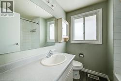 Full bathroom featuring vanity, dark wood finished floors, and shower / bathtub combination - 