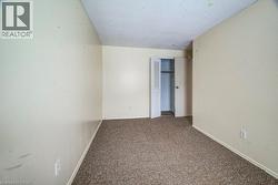 Unfurnished bedroom featuring carpet floors and a closet - 