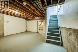 Unfinished basement featuring stairs - 