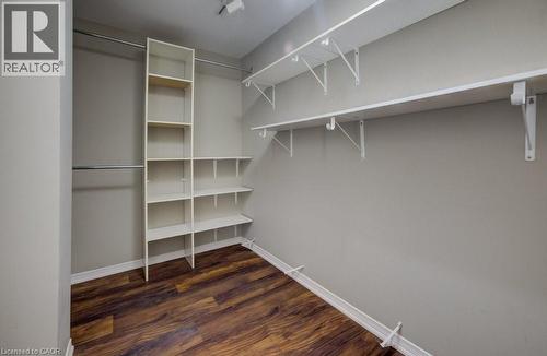 Walk in closet with dark wood-style floors - 54 Nicklaus Drive, Hamilton, ON - Indoor With Storage
