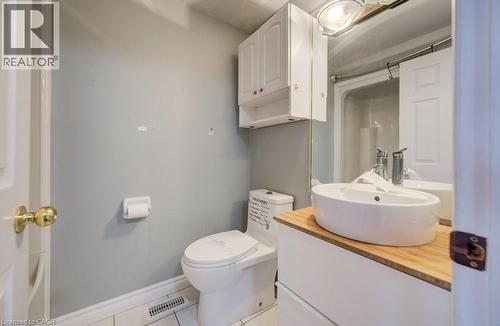 Full bath featuring vanity, light tile patterned floors, and a shower - 54 Nicklaus Drive, Hamilton, ON - Indoor Photo Showing Bathroom