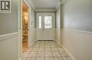 Entryway featuring ornamental molding and tile patterned floors - 54 Nicklaus Drive, Hamilton, ON  - Indoor Photo Showing Other Room 