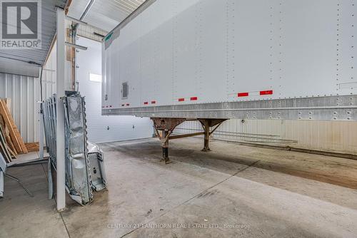 large bay with 14' drive in door - 19 Terry Fox Drive, Champlain, ON 