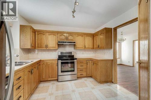 Kitchen - 106 Sienna Hills Drive Sw, Calgary, AB - Indoor Photo Showing Kitchen With Double Sink