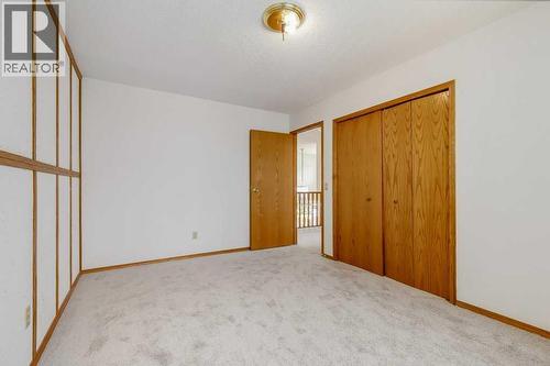 Bedroom - 106 Sienna Hills Drive Sw, Calgary, AB - Indoor Photo Showing Other Room