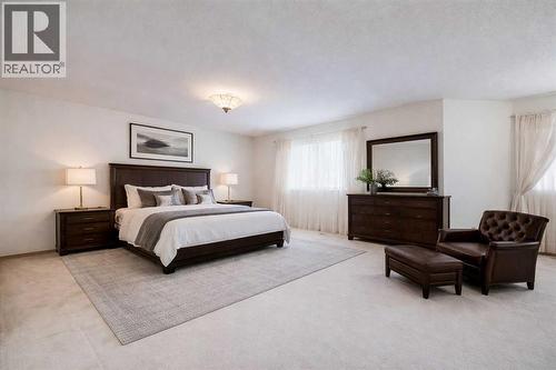 Virtual staged furniture - Primary bedroom - 106 Sienna Hills Drive Sw, Calgary, AB - Indoor Photo Showing Bedroom