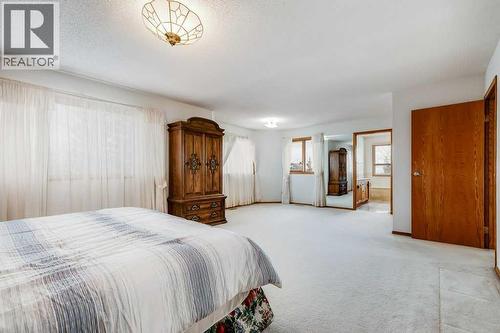 Primary Bedroom - 106 Sienna Hills Drive Sw, Calgary, AB - Indoor Photo Showing Bedroom