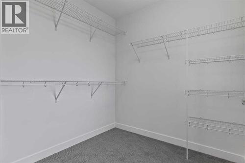 90 Heritage Circle, Cochrane, AB - Indoor With Storage