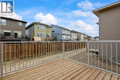 90 Heritage Circle, Cochrane, AB - Outdoor With Deck Patio Veranda With Exterior