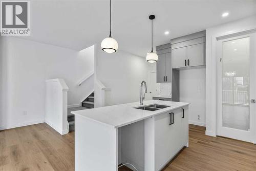 90 Heritage Circle, Cochrane, AB - Indoor Photo Showing Kitchen With Double Sink With Upgraded Kitchen
