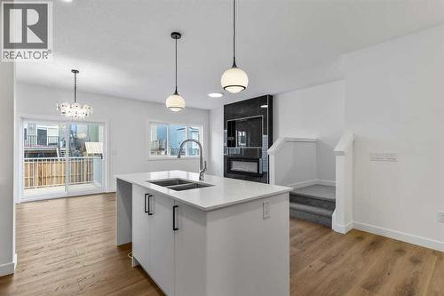 90 Heritage Circle, Cochrane, AB - Indoor Photo Showing Kitchen With Double Sink