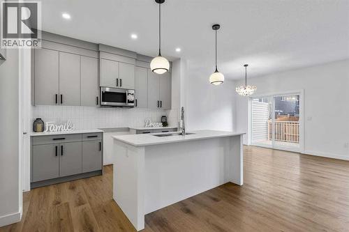 90 Heritage Circle, Cochrane, AB - Indoor Photo Showing Kitchen With Upgraded Kitchen