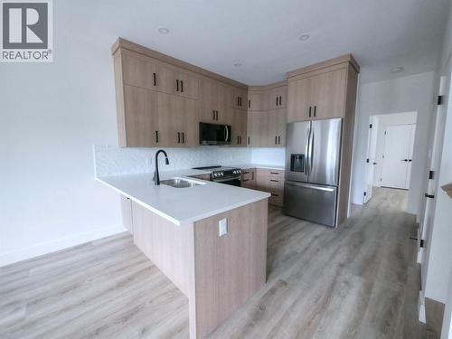 88 Nelson Avenue S Unit# 3, Nakusp, BC - Indoor Photo Showing Kitchen With Double Sink
