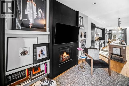 1910 48 Avenue Sw, Calgary, AB - Indoor Photo Showing Living Room With Fireplace
