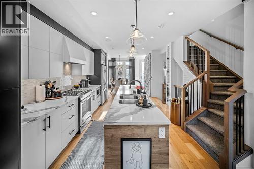 1910 48 Avenue Sw, Calgary, AB - Indoor Photo Showing Kitchen With Double Sink With Upgraded Kitchen