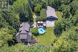 Aerial view of house, fire pit and detached garage - 