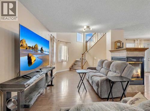 Living - 60 Sherwood Way Nw, Calgary, AB - Indoor Photo Showing Living Room With Fireplace