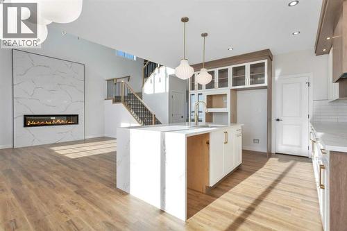 19 Everson Close, Red Deer, AB - Indoor Photo Showing Kitchen With Fireplace
