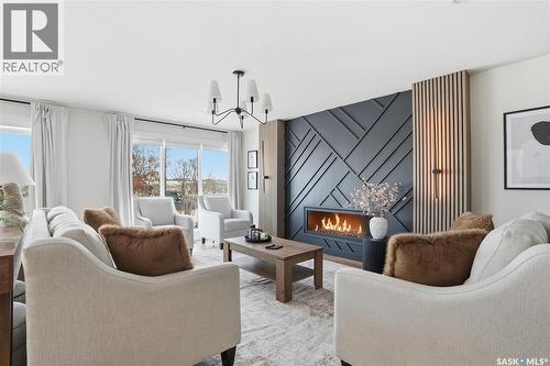 115 Whiteswan Drive, Saskatoon, SK - Indoor Photo Showing Living Room With Fireplace