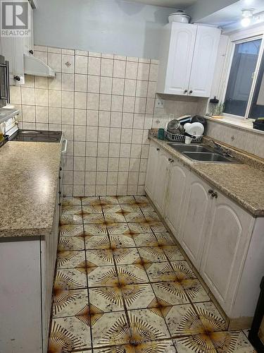 7053 Harwick Drive, Mississauga, ON - Indoor Photo Showing Kitchen With Double Sink