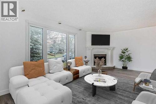 39 Bermuda Drive, Calgary, AB - Indoor Photo Showing Living Room With Fireplace