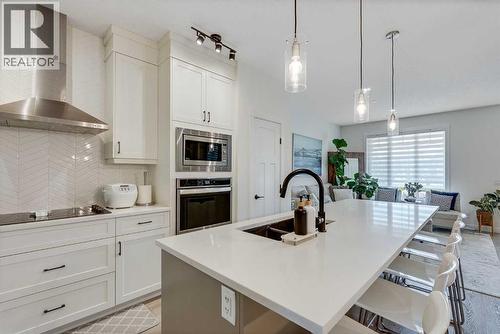145 Lucas Crescent Nw, Calgary, AB - Indoor Photo Showing Kitchen With Double Sink With Upgraded Kitchen